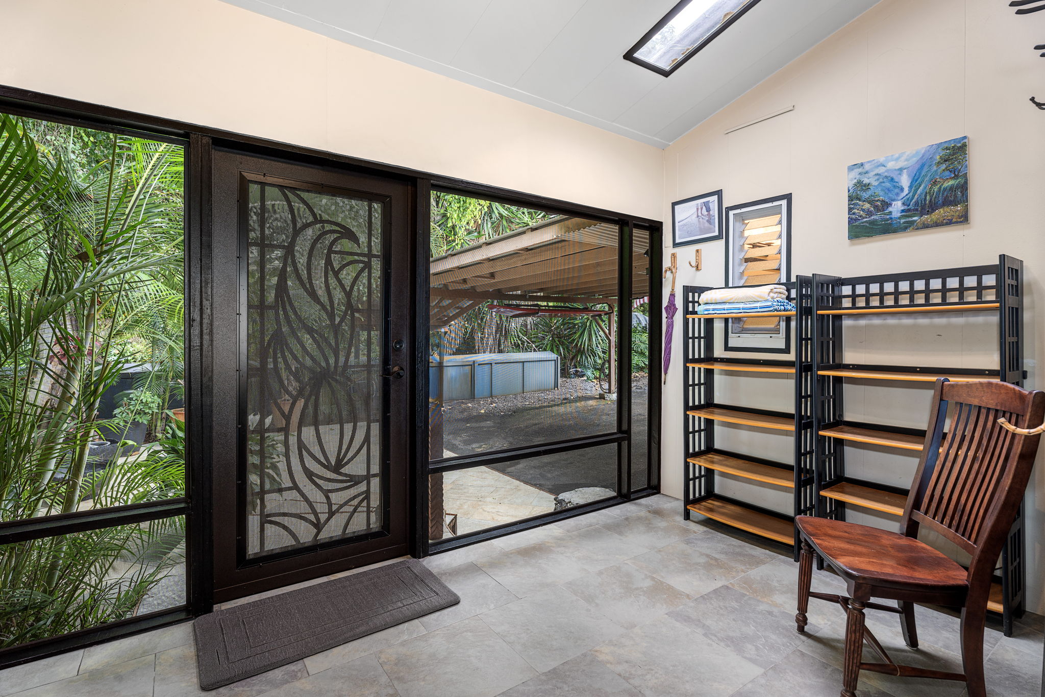 78-6960-a Walua Road Kailua-Kona, HI 96740 - Photo 9 of 29 a view of front door with furniture and a gate