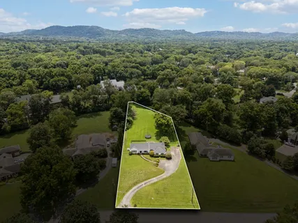 an aerial view of a house with a garden