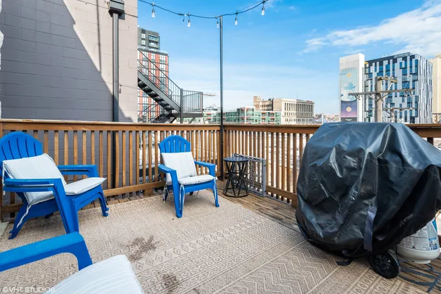 a view of two chairs in the balcony
