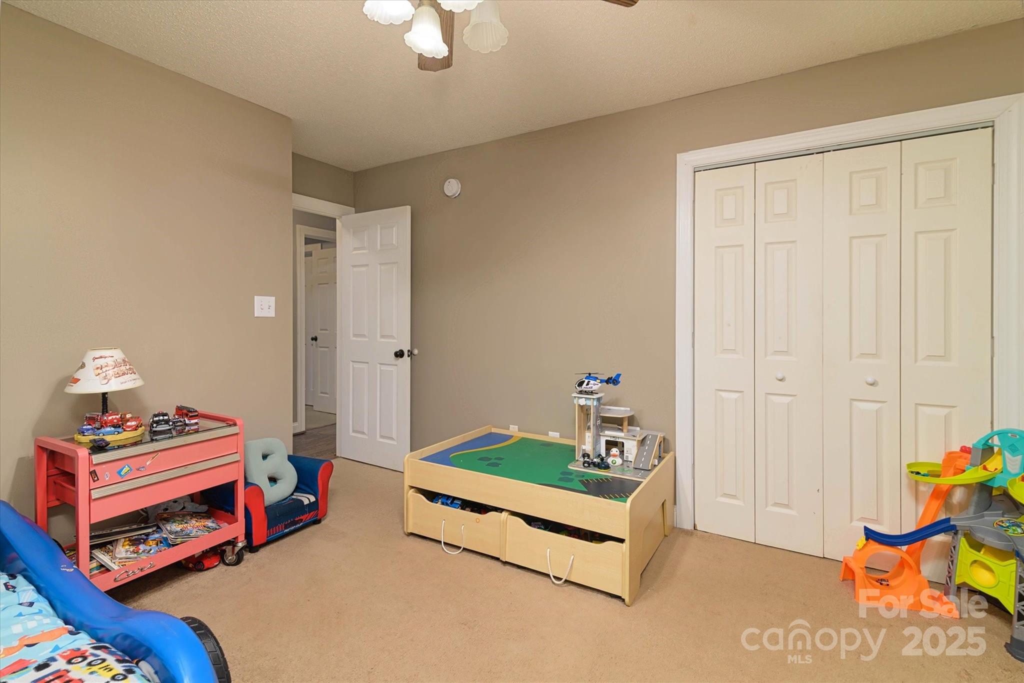 914 Ragin Lane Rock Hill, SC 29732 - Photo 27 of 31 a bedroom with furniture and a chandelier