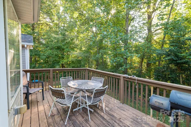 a view of balcony with furniture and wooden deck