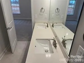 a bathroom with a sink and mirror