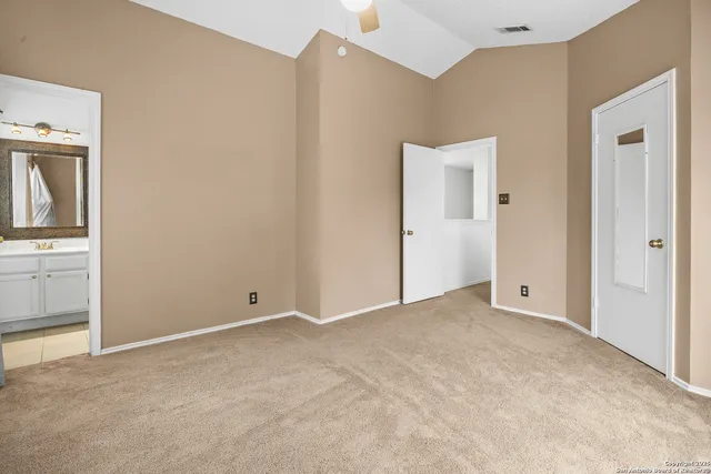 an empty room with windows and closet