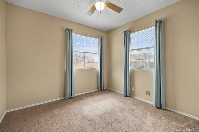 a bathroom with a sink toilet vanity and shower