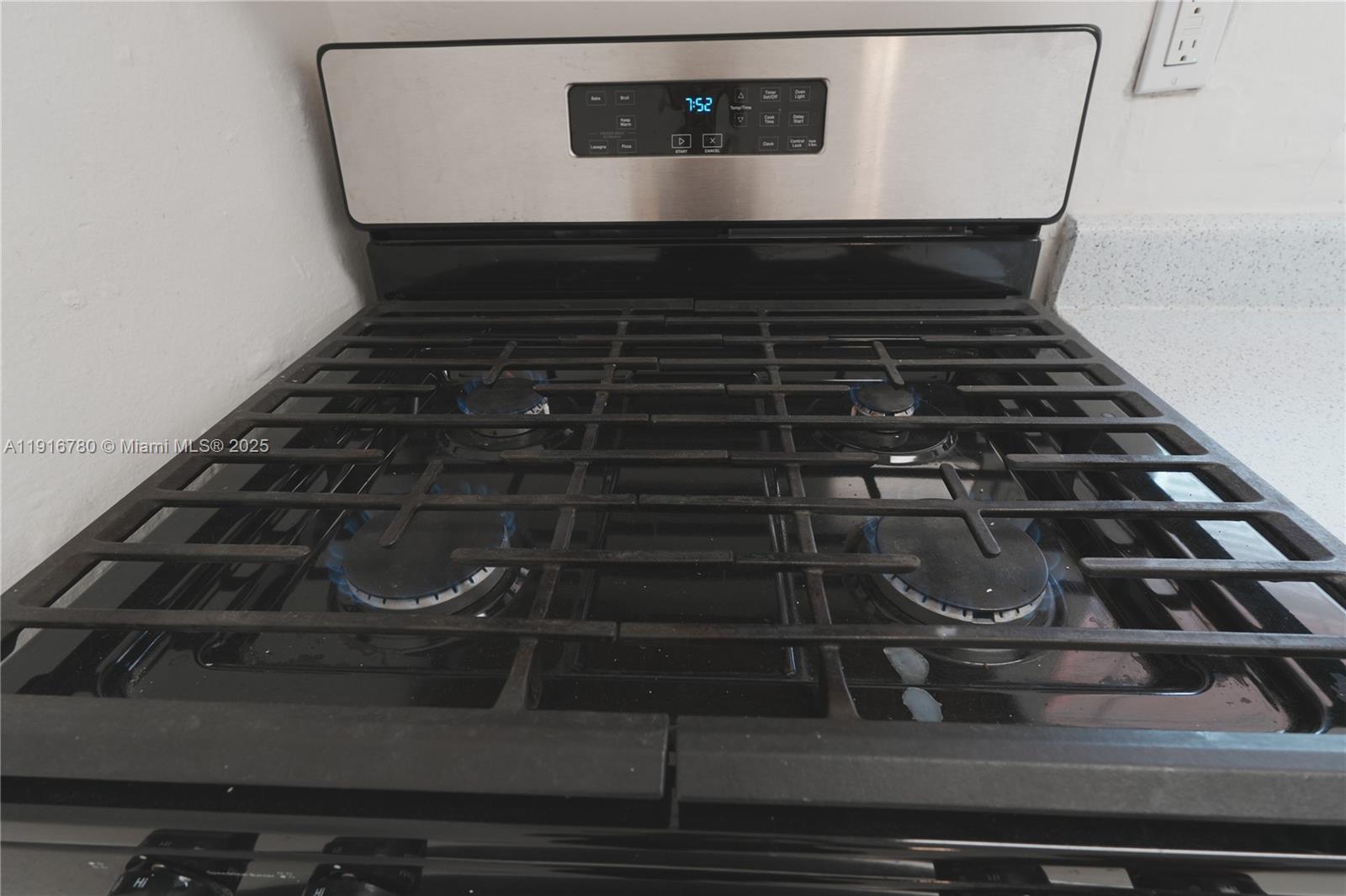 1245 West 24th Street, Unit 210 Hialeah, FL 33010 - Photo 13 of 22 a close view of stove