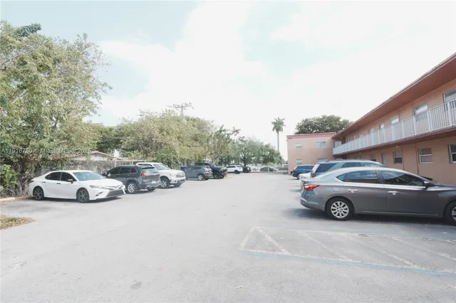 a view of a cars parked in front of a house