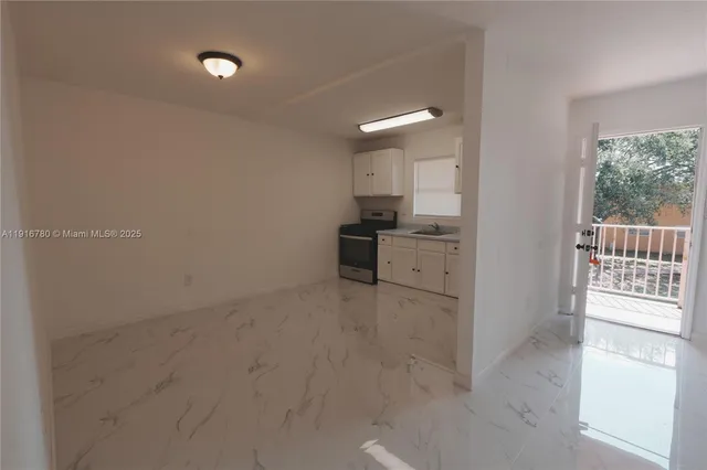 a view of a kitchen with a sink