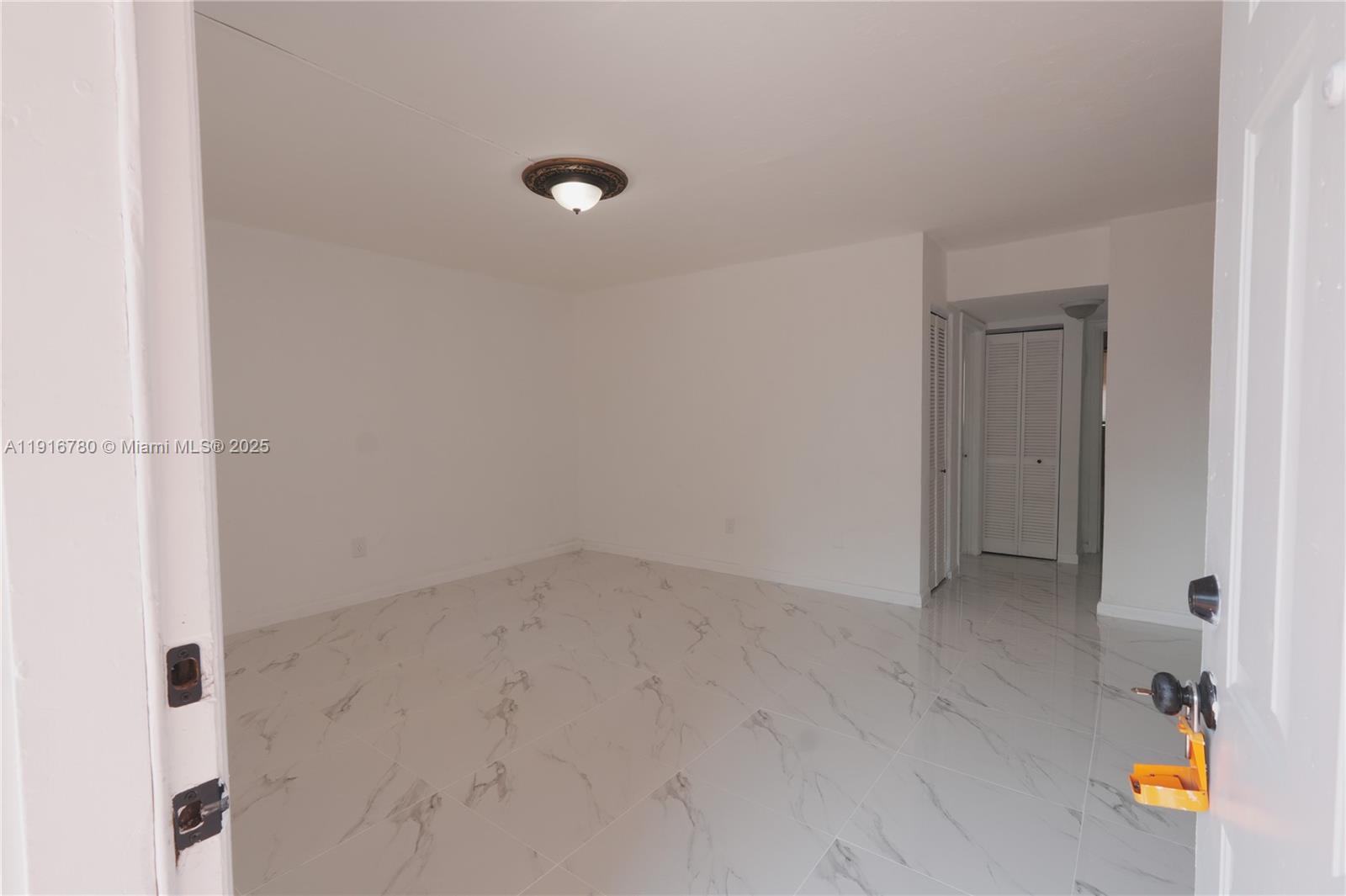 1245 West 24th Street, Unit 210 Hialeah, FL 33010 - Photo 5 of 22 a view of an empty room