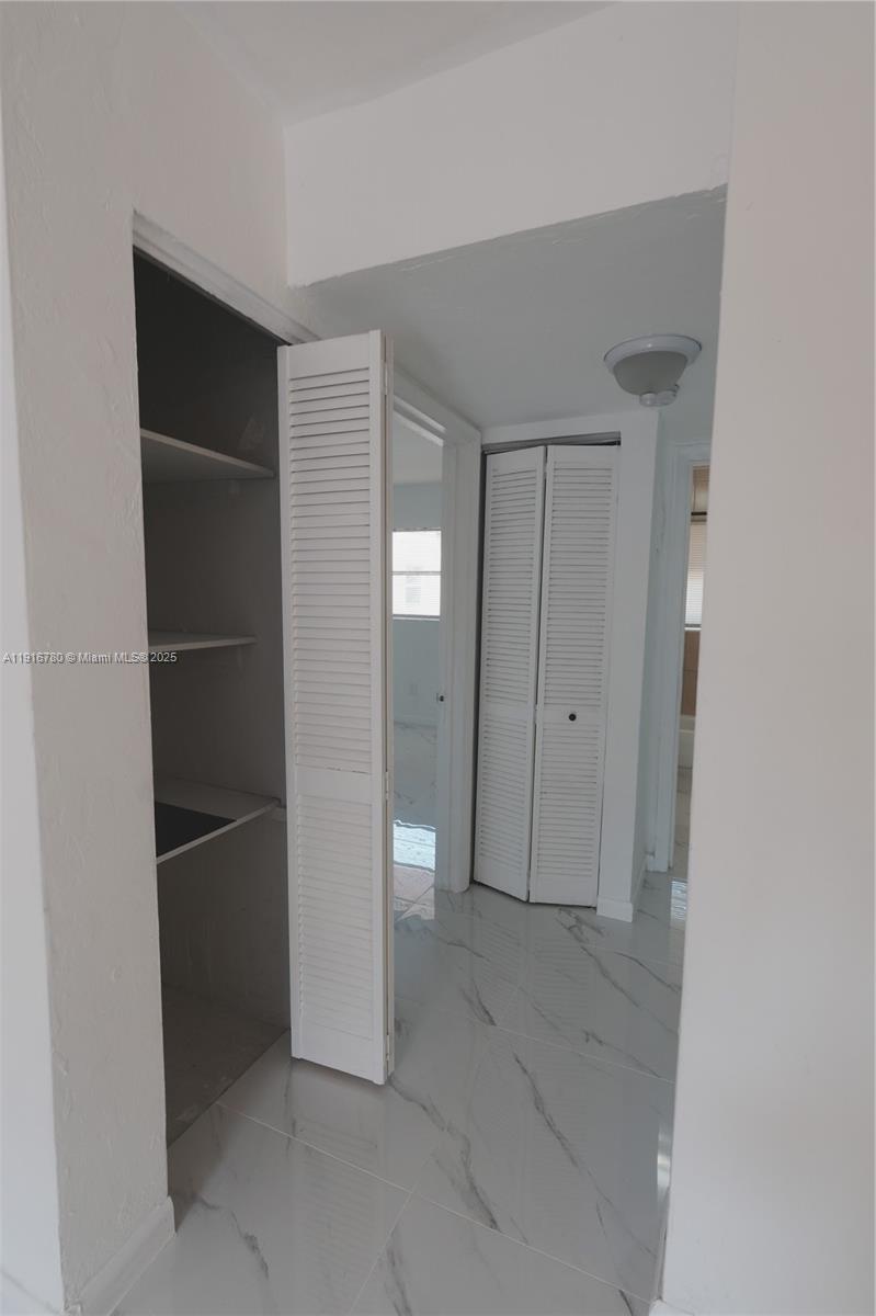 1245 West 24th Street, Unit 210 Hialeah, FL 33010 - Photo 7 of 22 a view of an empty room