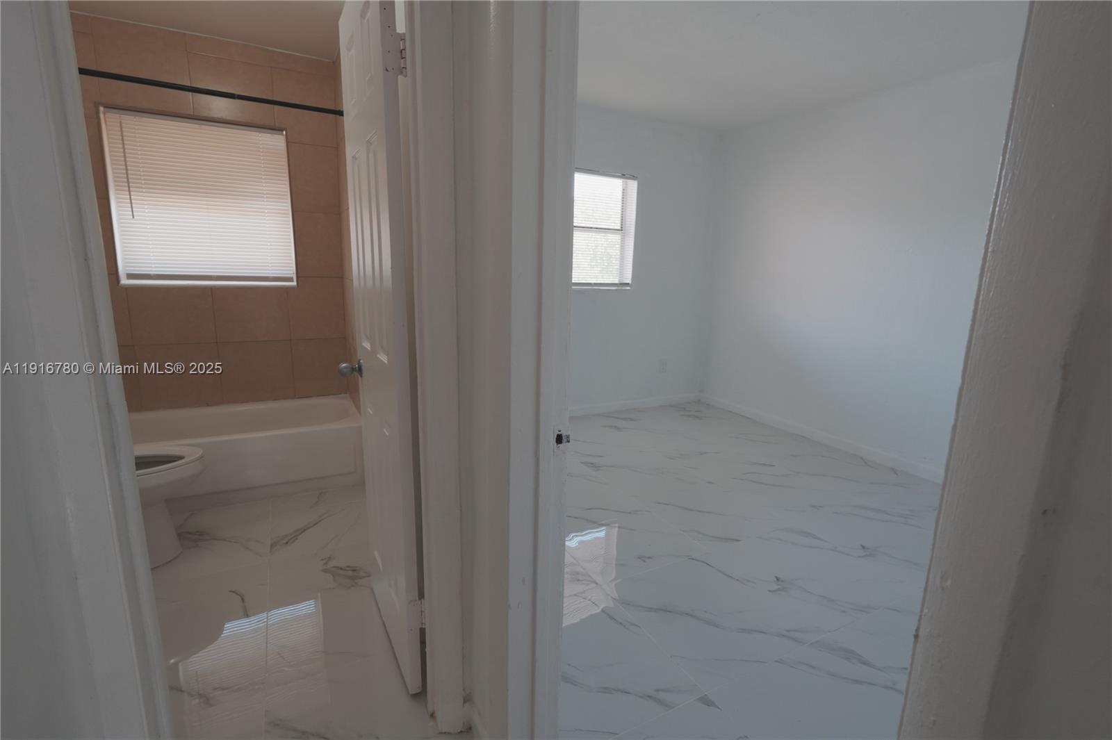 1245 West 24th Street, Unit 210 Hialeah, FL 33010 - Photo 8 of 22 a bathroom with a bathtub