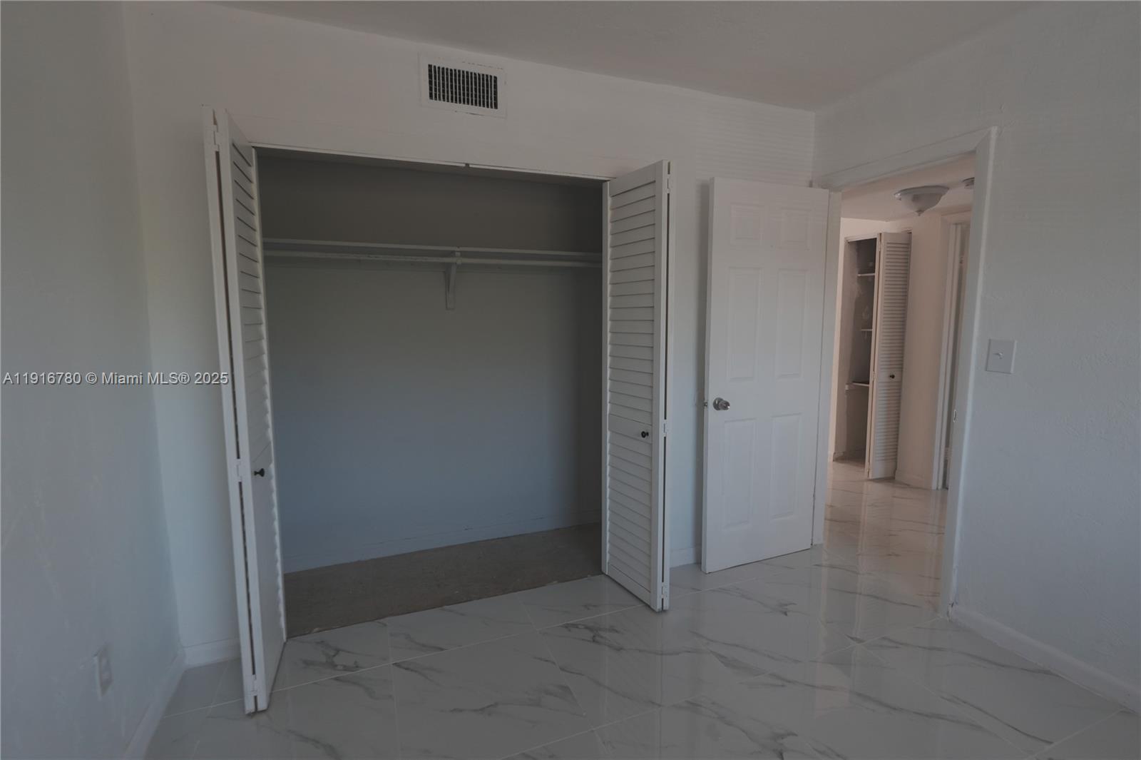 1245 West 24th Street, Unit 210 Hialeah, FL 33010 - Photo 9 of 22 a view of an empty room