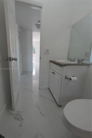 a bathroom with a sink and toilet