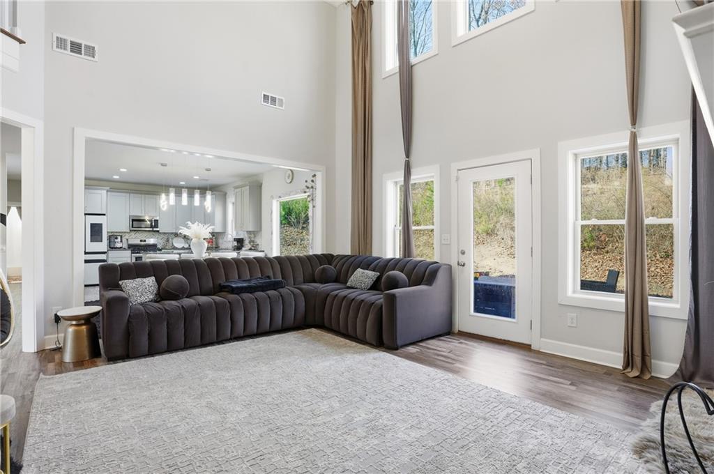 5663 Eternal Drive Atlanta, GA 30349 - Photo 12 of 37 a living room with furniture and a large window