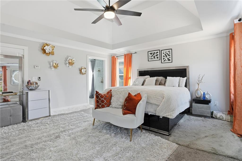 5663 Eternal Drive Atlanta, GA 30349 - Photo 16 of 37 a bedroom with a bed and dresser