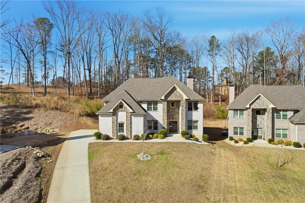 5663 Eternal Drive Atlanta, GA 30349 - Photo 31 of 37 a front view of a house with a yard and tree s