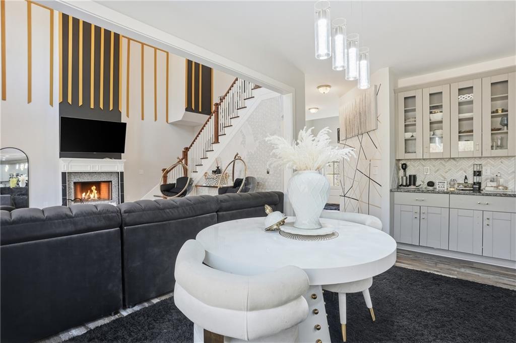 5663 Eternal Drive Atlanta, GA 30349 - Photo 9 of 37 a living room with furniture and a fireplace