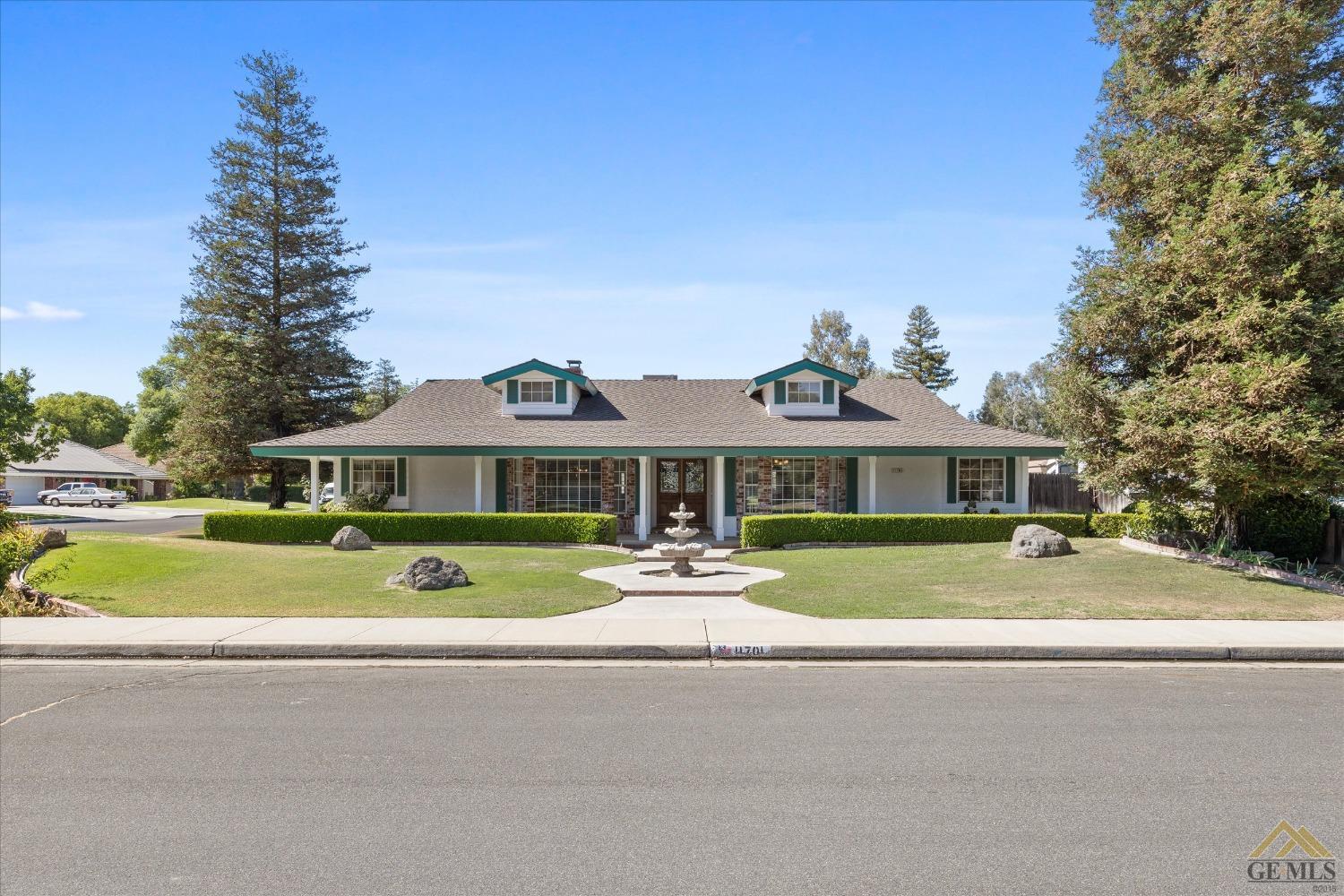 Undisclosed Address Bakersfield, CA 93312 - Photo 11 of 46 a front view of a house with swimming pool having outdoor seating