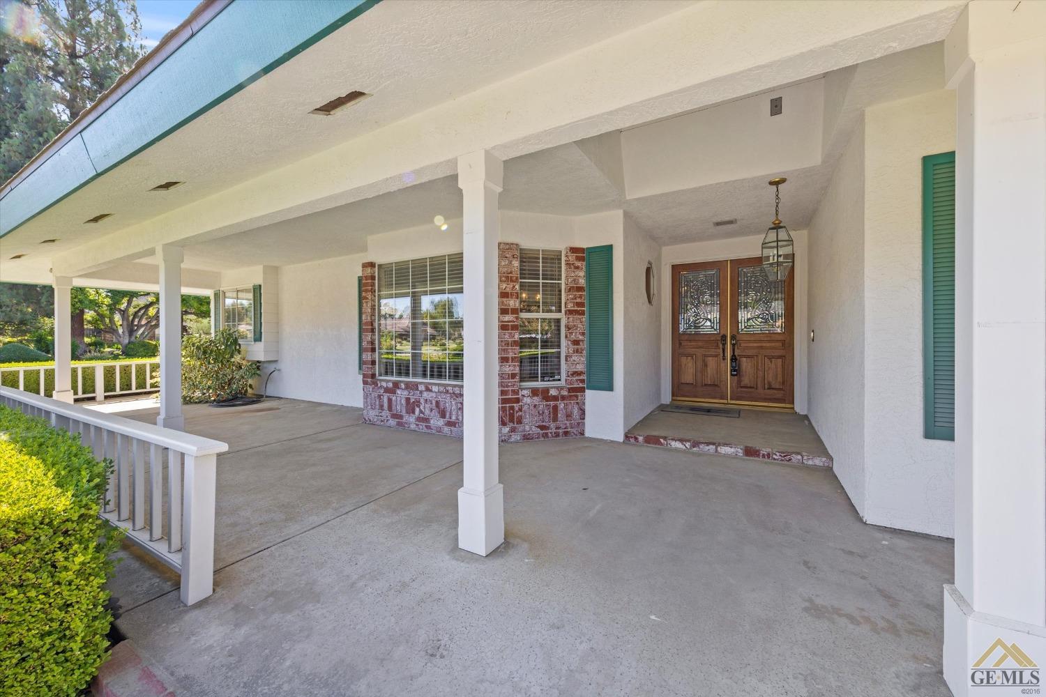 Undisclosed Address Bakersfield, CA 93312 - Photo 13 of 46 a view of an entrance to house with yard