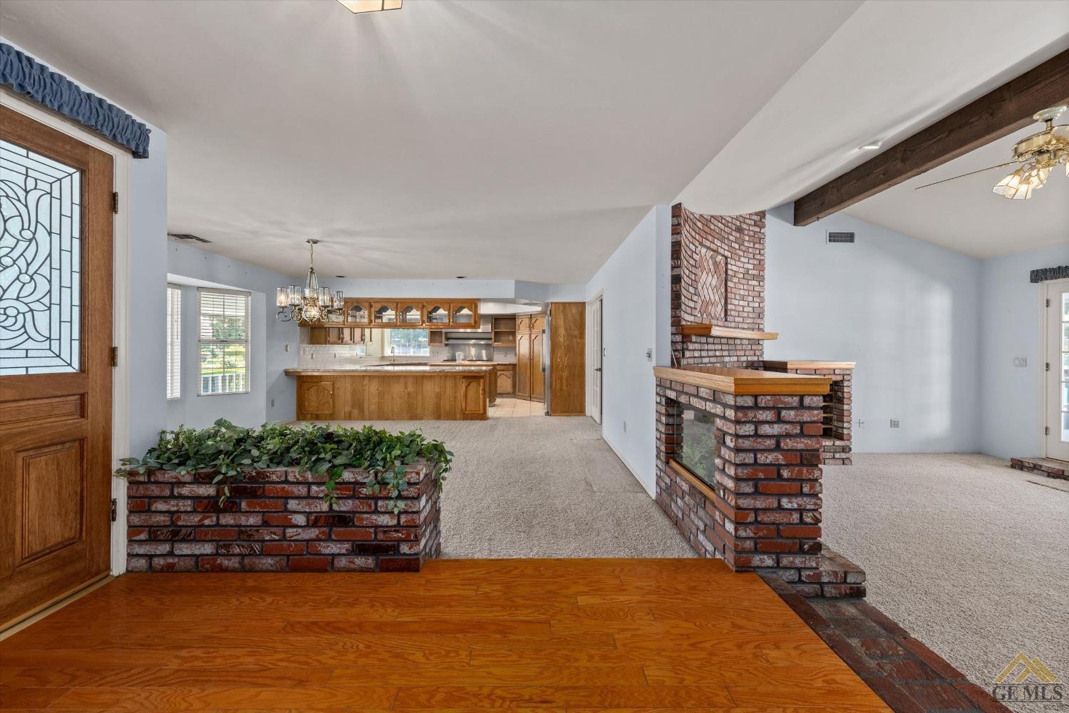 Undisclosed Address Bakersfield, CA 93312 - Photo 15 of 46 a view of livingroom with furniture and floor to ceiling window