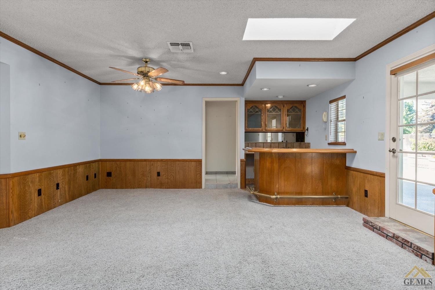 Undisclosed Address Bakersfield, CA 93312 - Photo 21 of 46 a view of an empty room with window and cabinet
