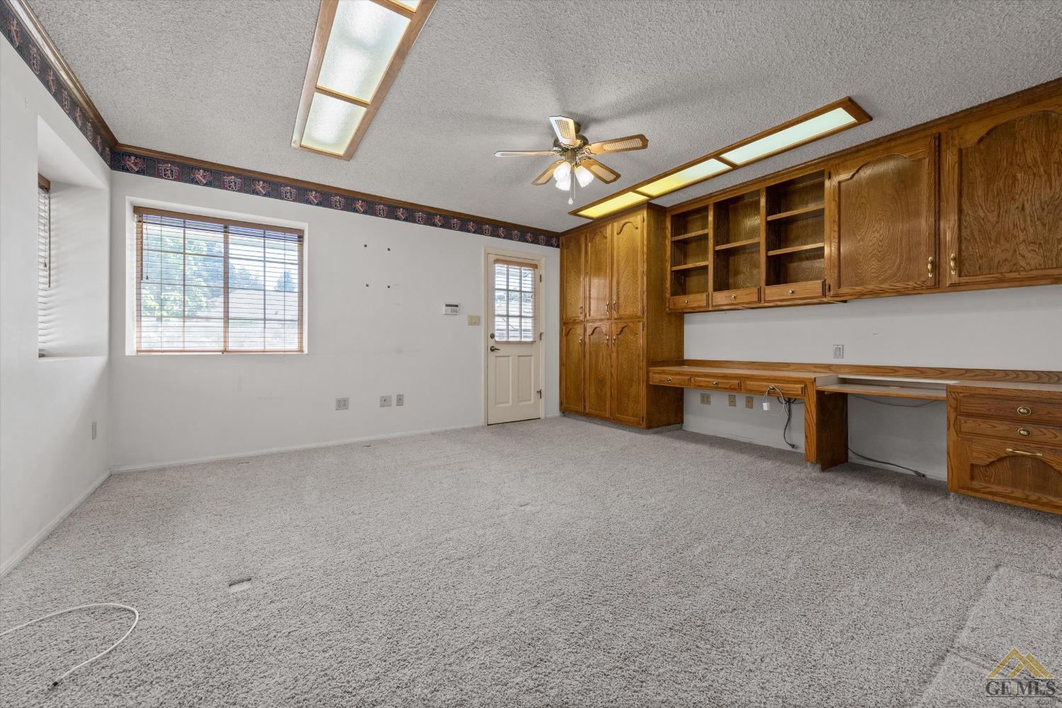 Undisclosed Address Bakersfield, CA 93312 - Photo 30 of 46 a view of an empty room with a window