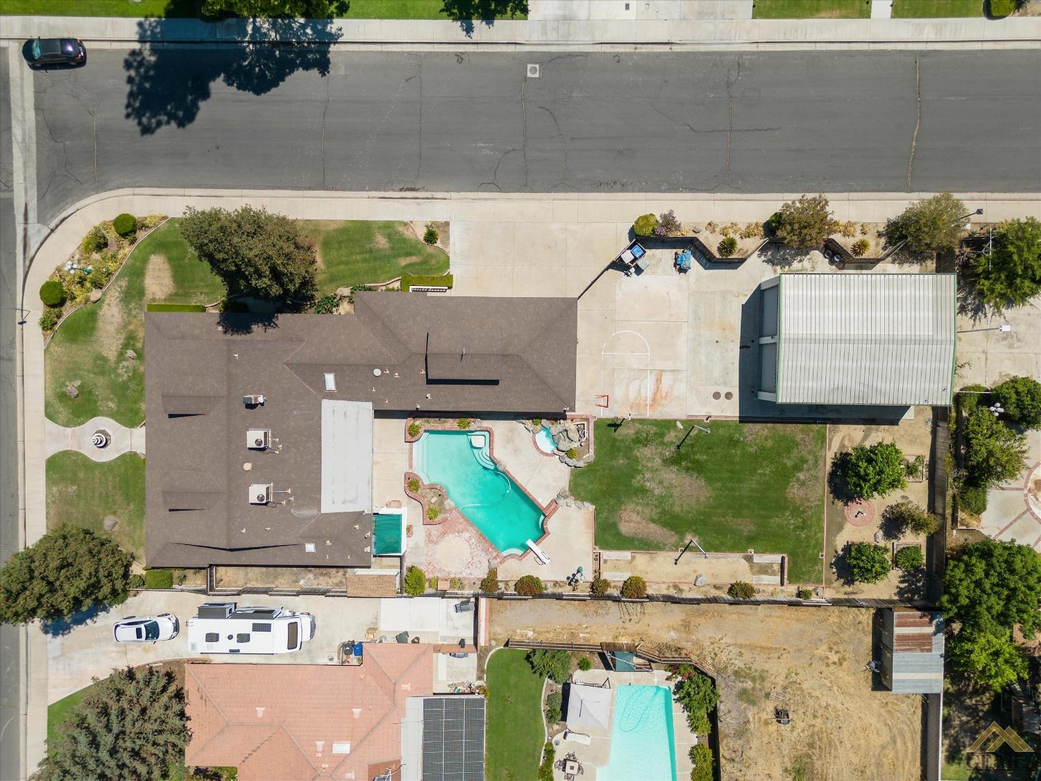 Undisclosed Address Bakersfield, CA 93312 - Photo 4 of 46 an aerial view of a house with a swimming pool