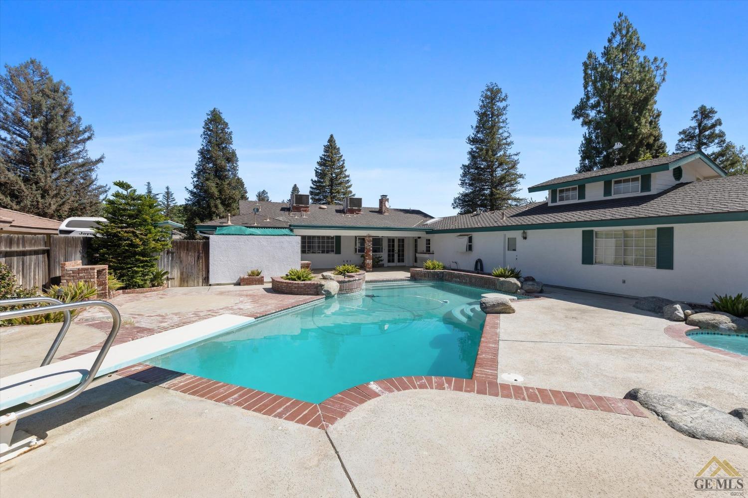 Undisclosed Address Bakersfield, CA 93312 - Photo 45 of 46 a front view of a house with garden