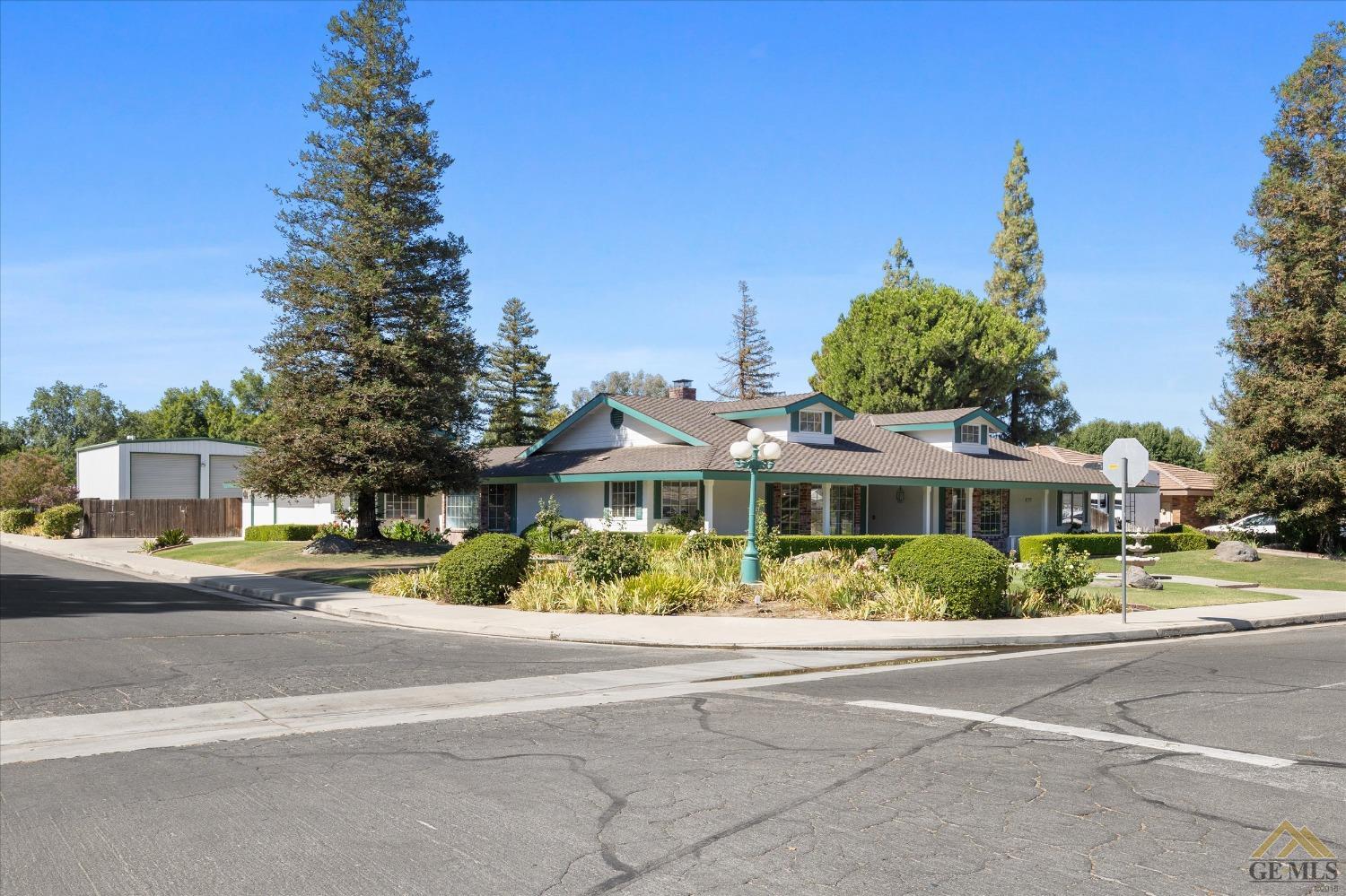 Undisclosed Address Bakersfield, CA 93312 - Photo 9 of 46 front view of a house with a street