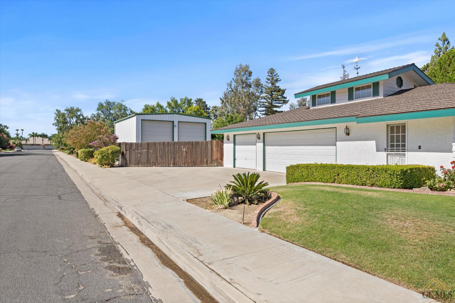 Undisclosed Address Bakersfield, CA 93312 - Photo 10 of 46 front view of a house with a yard