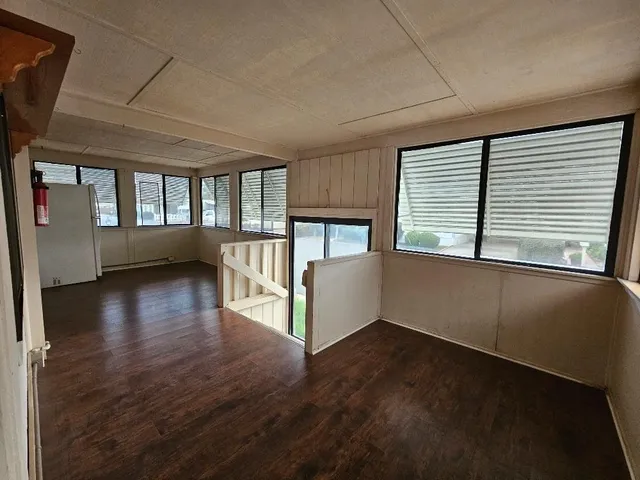 a view of an entryway with wooden floor