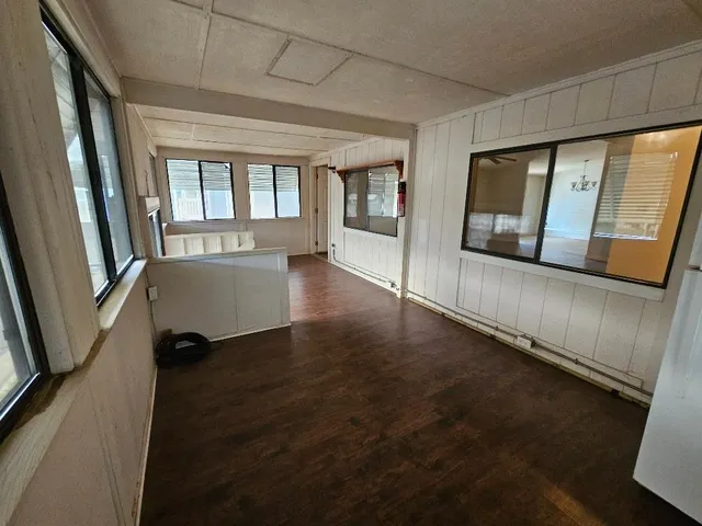 a backyard of a house with wooden fence
