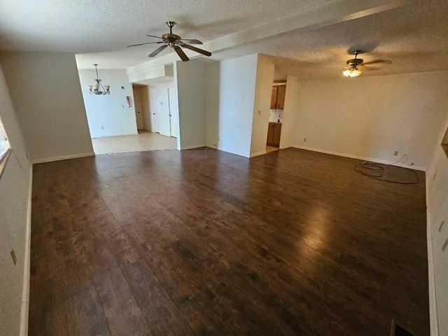 a view of empty room with windows