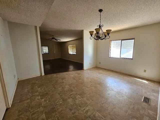 a view of storage and utility room with refrigerator