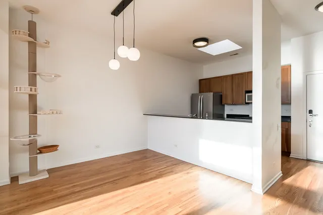 a view of a kitchen from the hallway