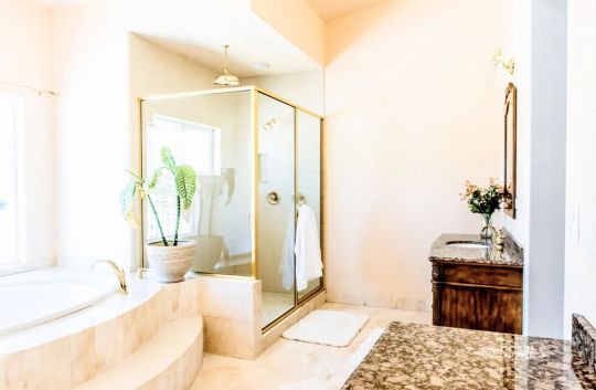 1652 Rademacher Way Ridgecrest, CA 93555 - Photo 6 of 16 a spacious bedroom with a bed and a couch