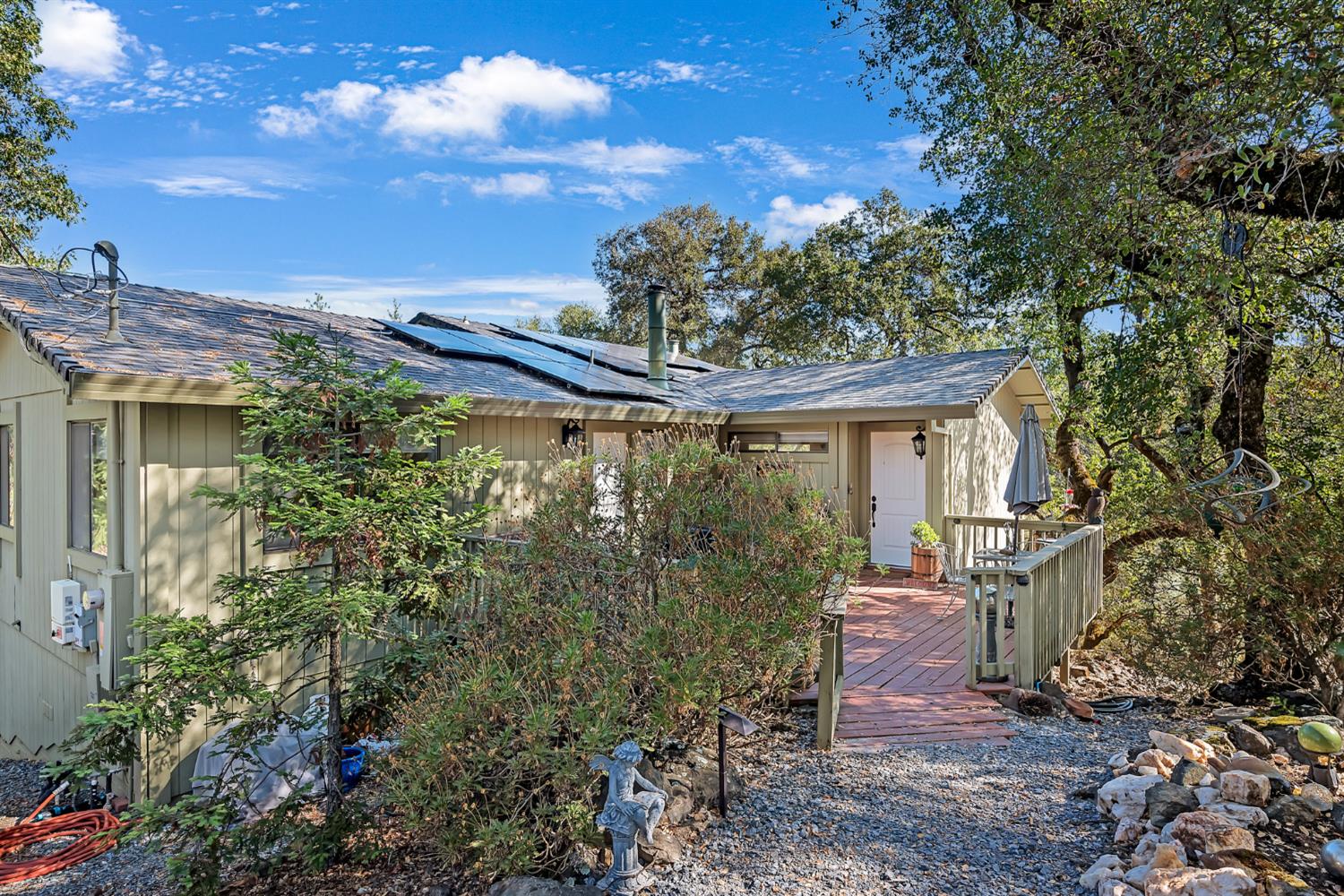 2505 Muir Court Cool, CA 95614 - Photo 29 of 56 a view of a patio with table and chairs and potted plants