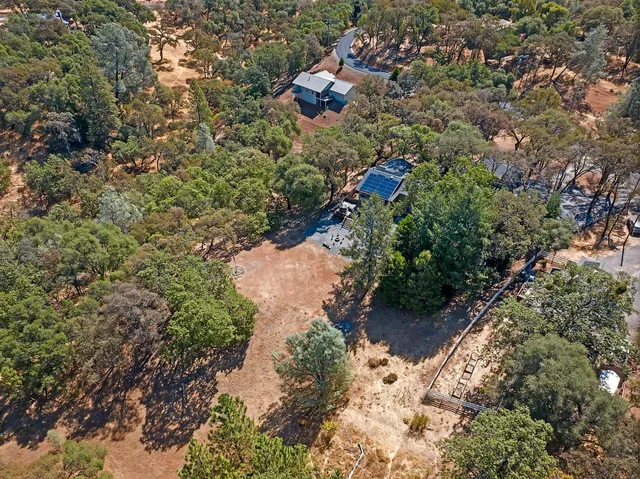 an aerial view of residential building and ocean