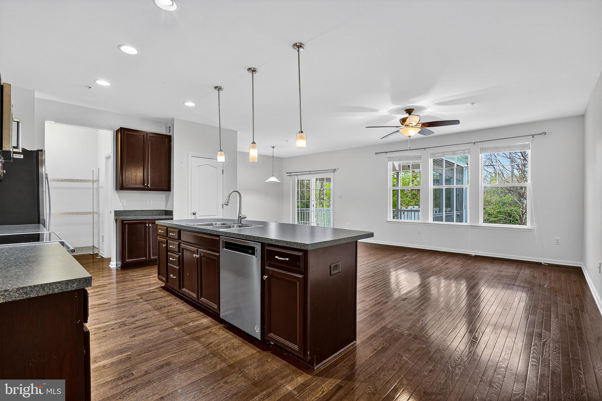 1925 Washburn Court Frederick, MD 21702 - Photo 12 of 41 a kitchen with stainless steel appliances granite countertop a sink a stove and a wooden floors