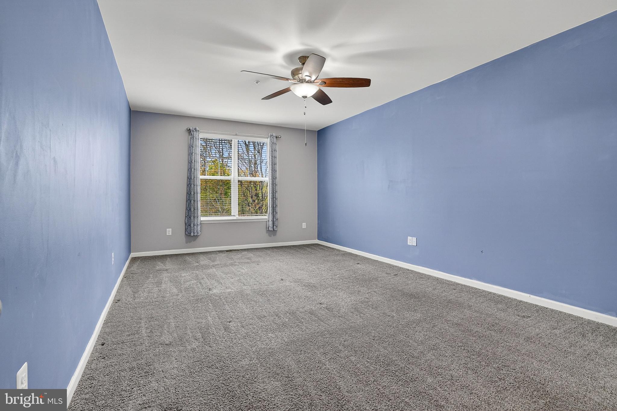 1925 Washburn Court Frederick, MD 21702 - Photo 17 of 41 an empty room with windows and ceiling fan