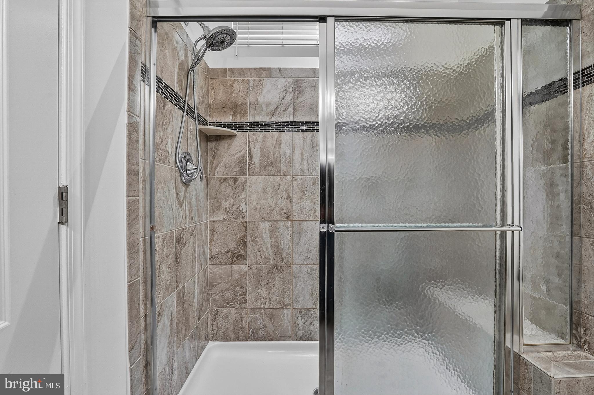 1925 Washburn Court Frederick, MD 21702 - Photo 20 of 41 a bathroom with a glass shower door