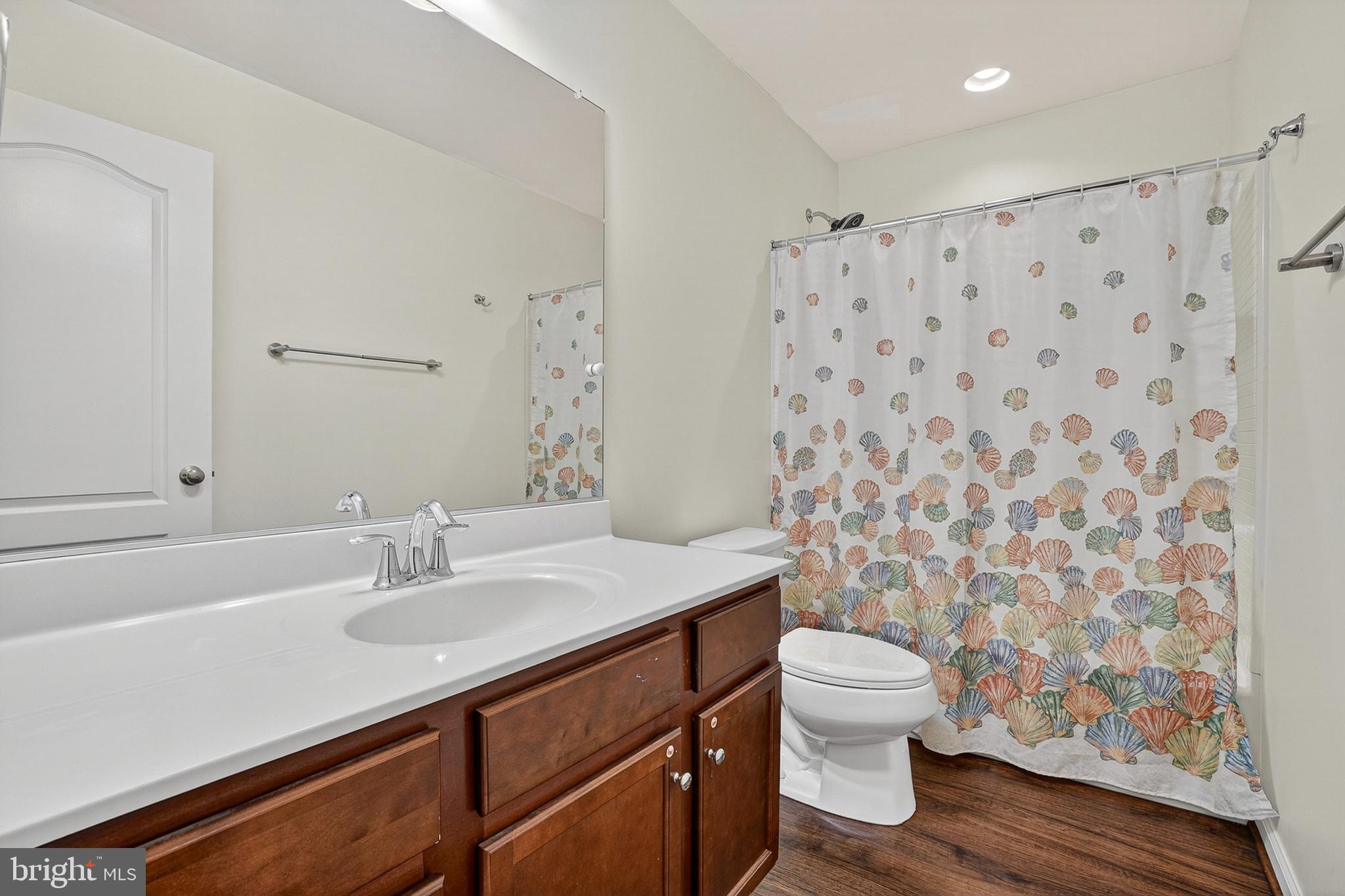 1925 Washburn Court Frederick, MD 21702 - Photo 27 of 41 a bathroom with a sink a toilet and shower curtain