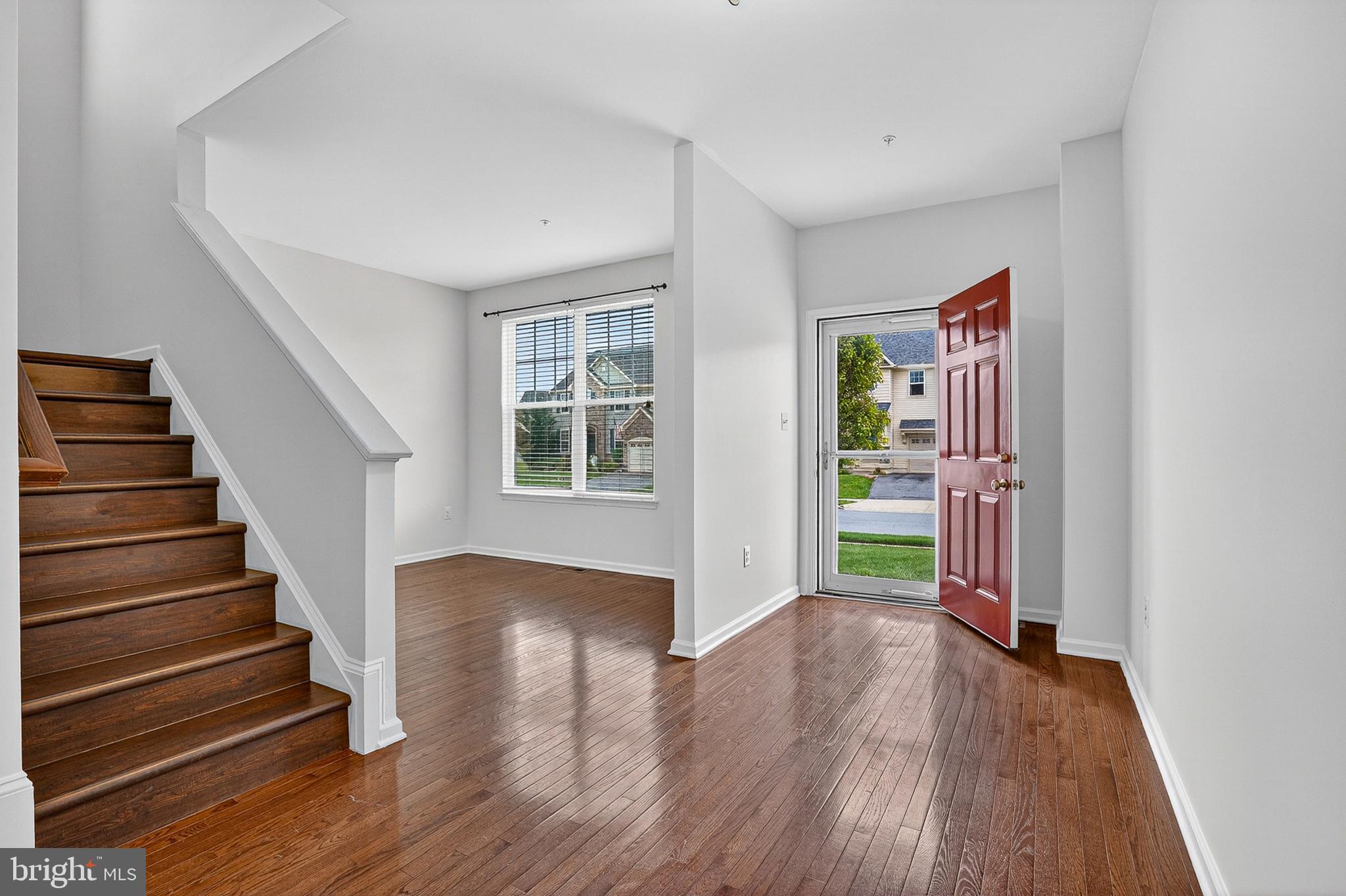 1925 Washburn Court Frederick, MD 21702 - Photo 5 of 41 a view of an entryway with wooden floor and stairs