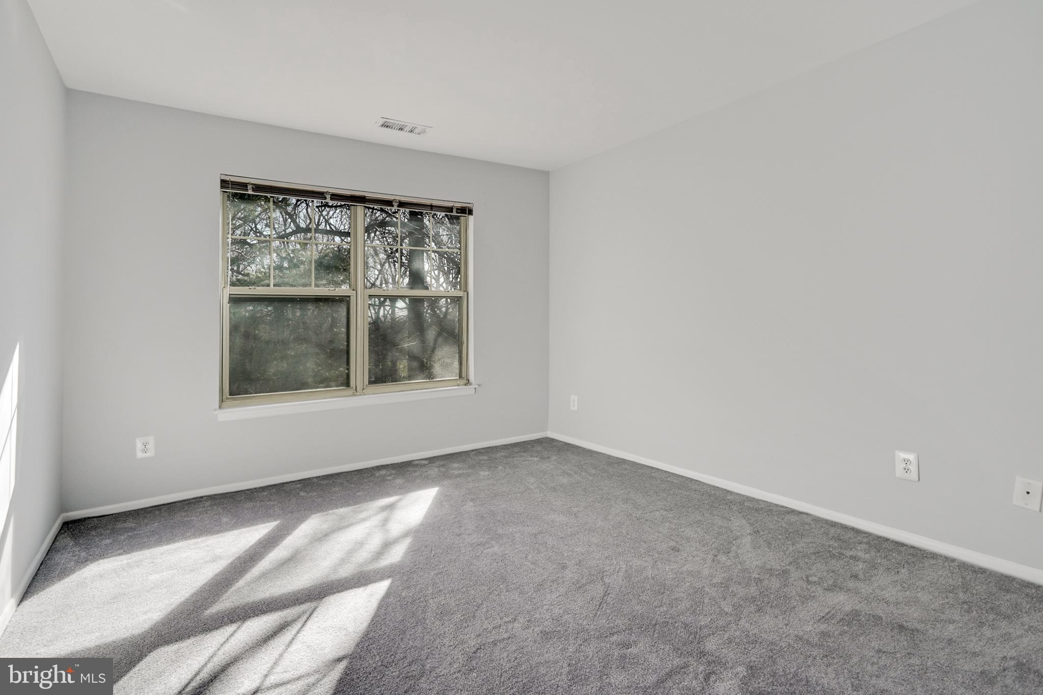 1781 Jonathan Way, Unit 1781I Reston, VA 20190 - Photo 13 of 48 a view of an empty room with a window