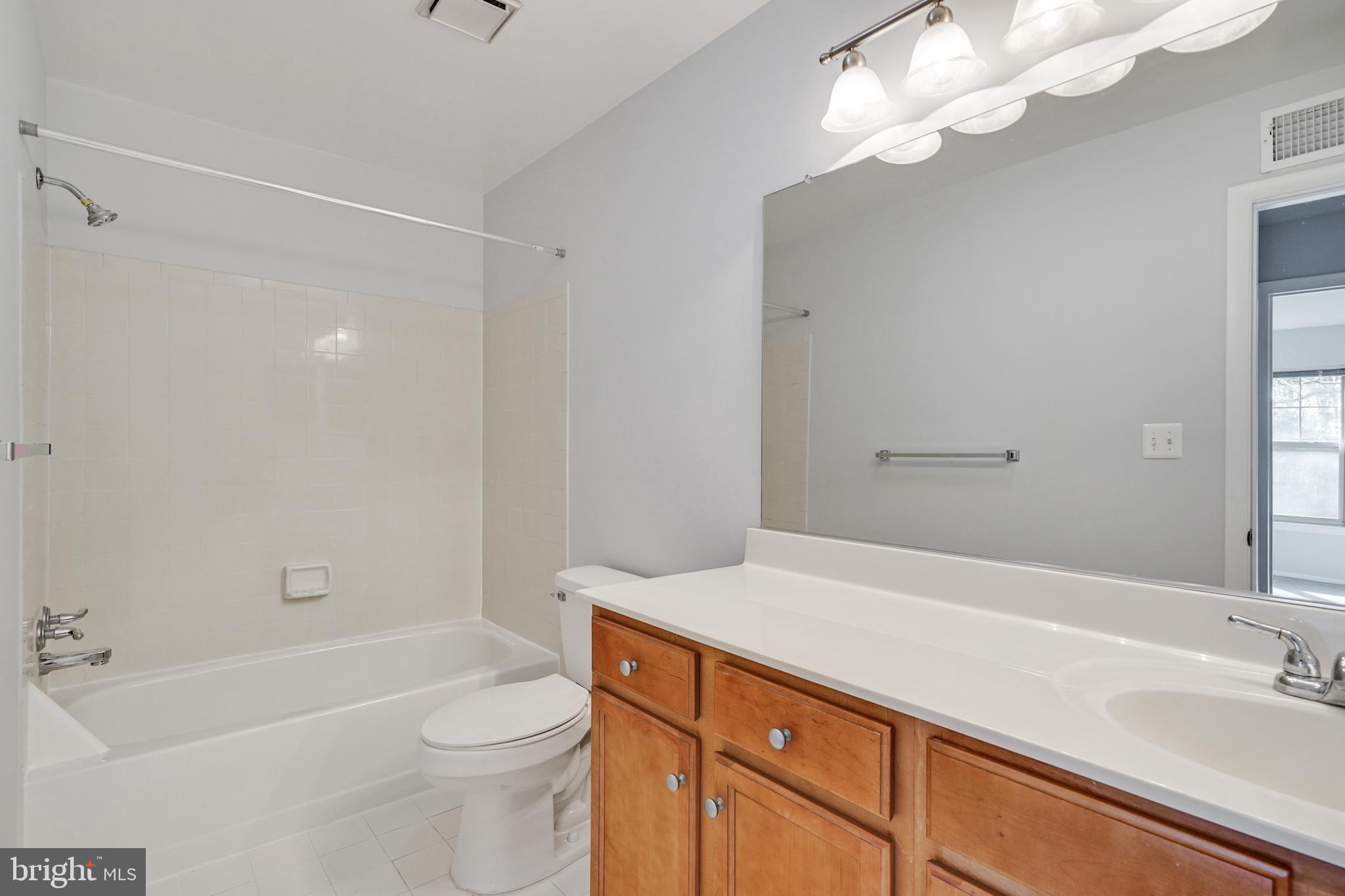 1781 Jonathan Way, Unit 1781I Reston, VA 20190 - Photo 15 of 48 a bathroom with a sink a toilet and shower