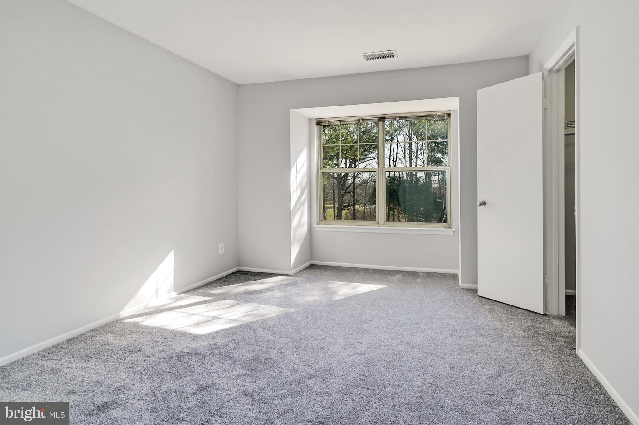 1781 Jonathan Way, Unit 1781I Reston, VA 20190 - Photo 16 of 48 an empty room with windows
