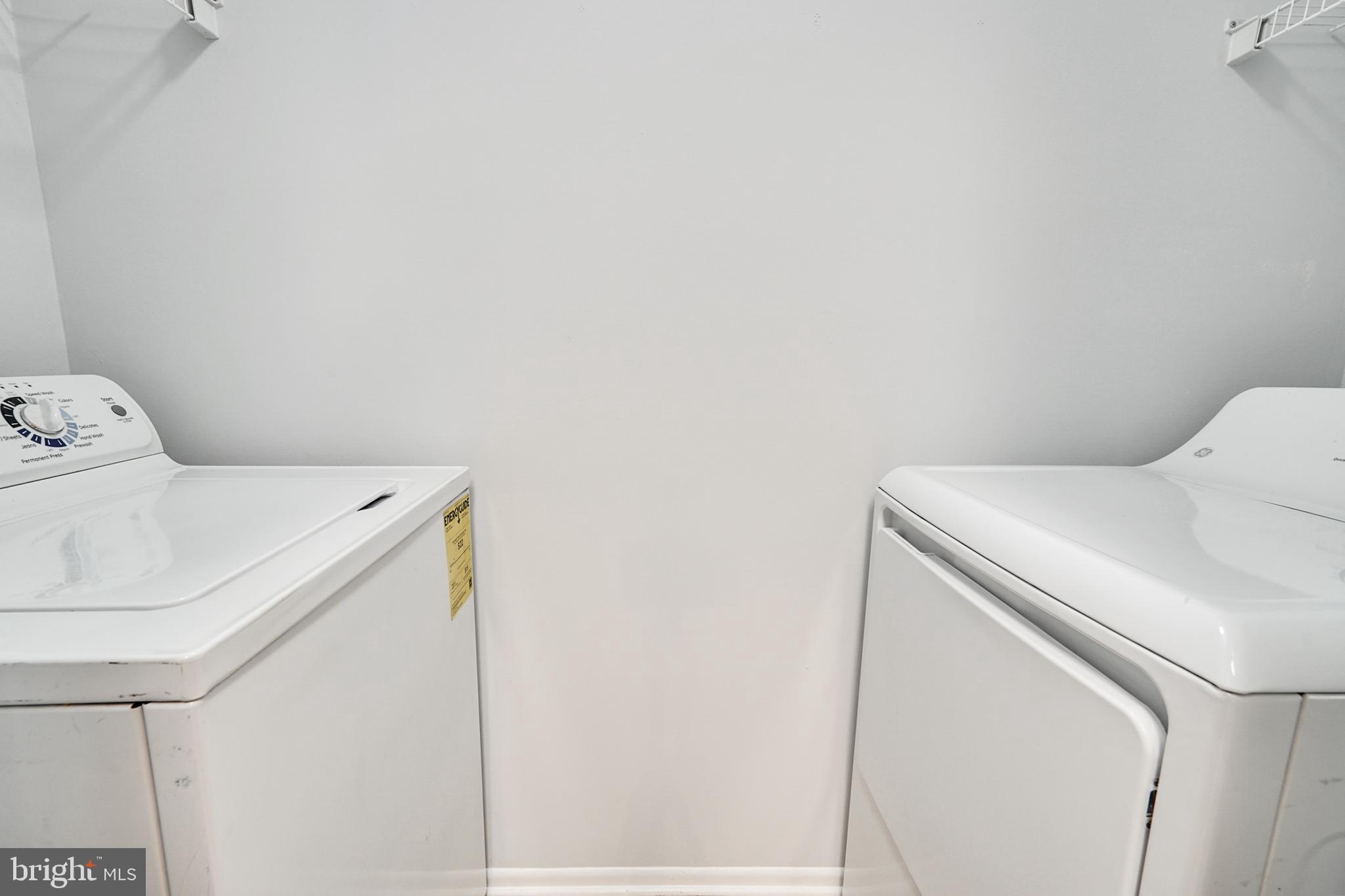 1781 Jonathan Way, Unit 1781I Reston, VA 20190 - Photo 19 of 48 a utility room with dryer and washer