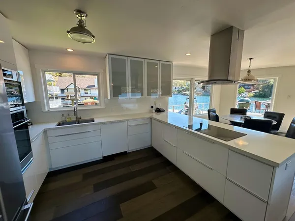 a kitchen with sink cabinets and window