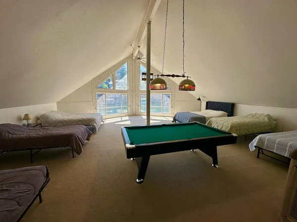 a living room with furniture and next to a window