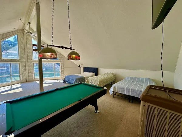 a bedroom with bed and a window