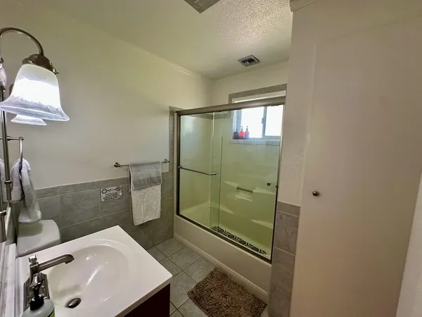 a bathroom with a sink and shower